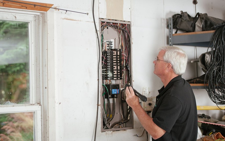 Electrician testing a residential switchboard