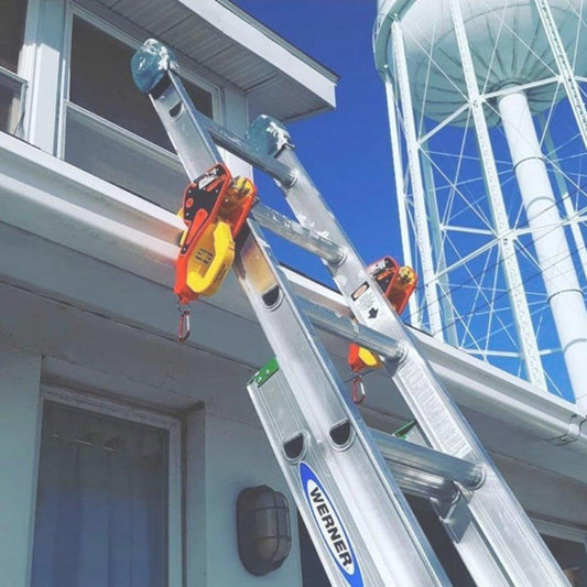 Two gutter clamps holding the ladder rails to the gutter lip