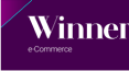  "Winner e-Commerce" text in white on a dark purple background, likely indicating an award or recognition.
