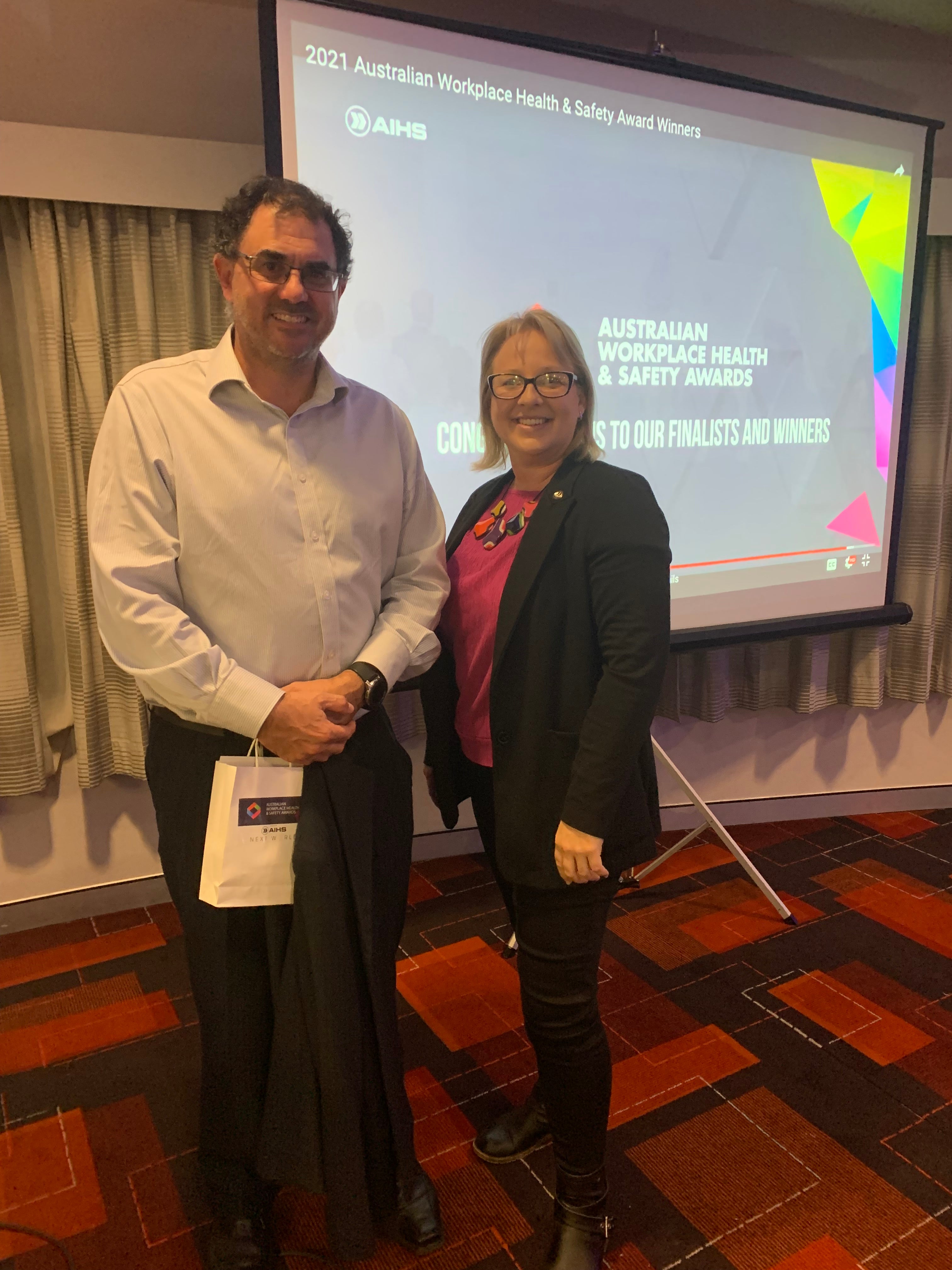 Craig from Lock Jaw Ladder Grip at the 2021 Australian Workplace Health and Safety Awards with fellow finalist, celebrating recognition for workplace safety innovation