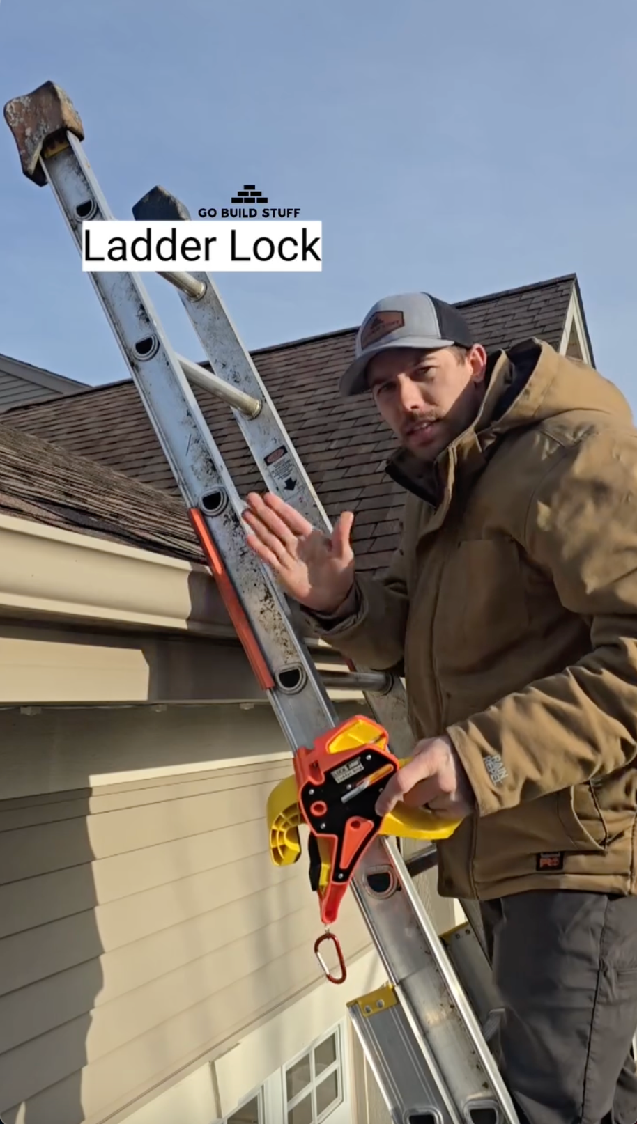 A man holds a Lock Jaw Ladder Grip attached to a ladder, with text overlay "Ladder Lock".