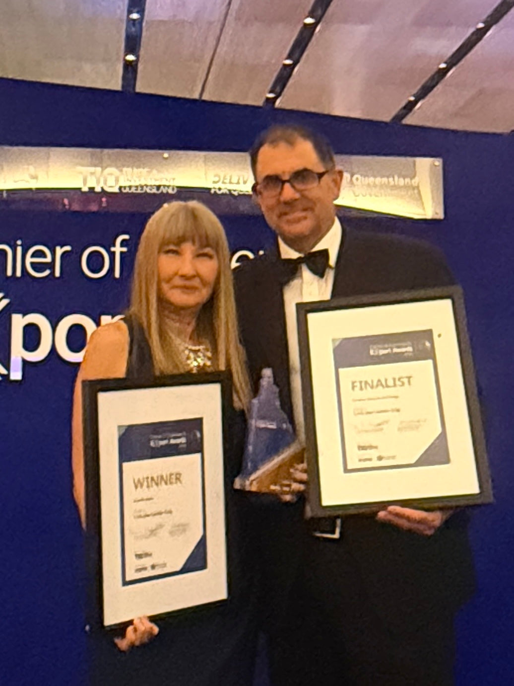 Lock Jaw Ladder Grip representatives holding winner and finalist certificates and a trophy at the 2026 Queensland Export Awards