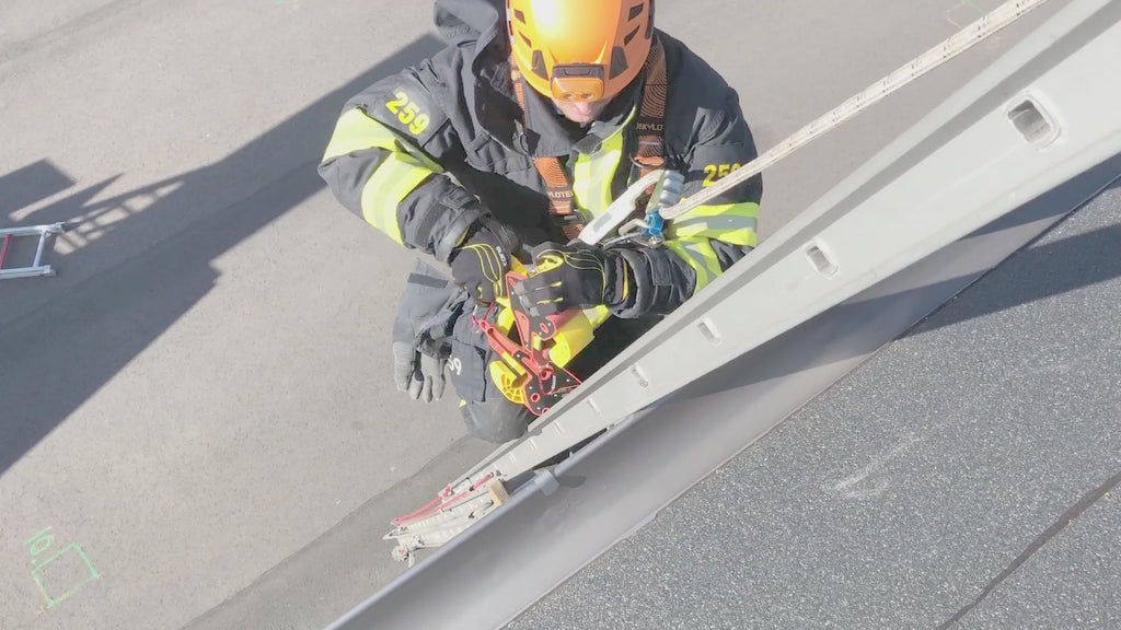 Fire and Rescue employee using lock jaw ladder grip product with full gear